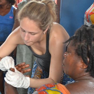 Projects Abroad Medical intern treats a local woman's finger at a Medical Outreach programme on a Medicine placement in Ghana. Female Medical intern treats a local woman's finger at a Public Health Outreach programme during her Medical placement in Ghana.